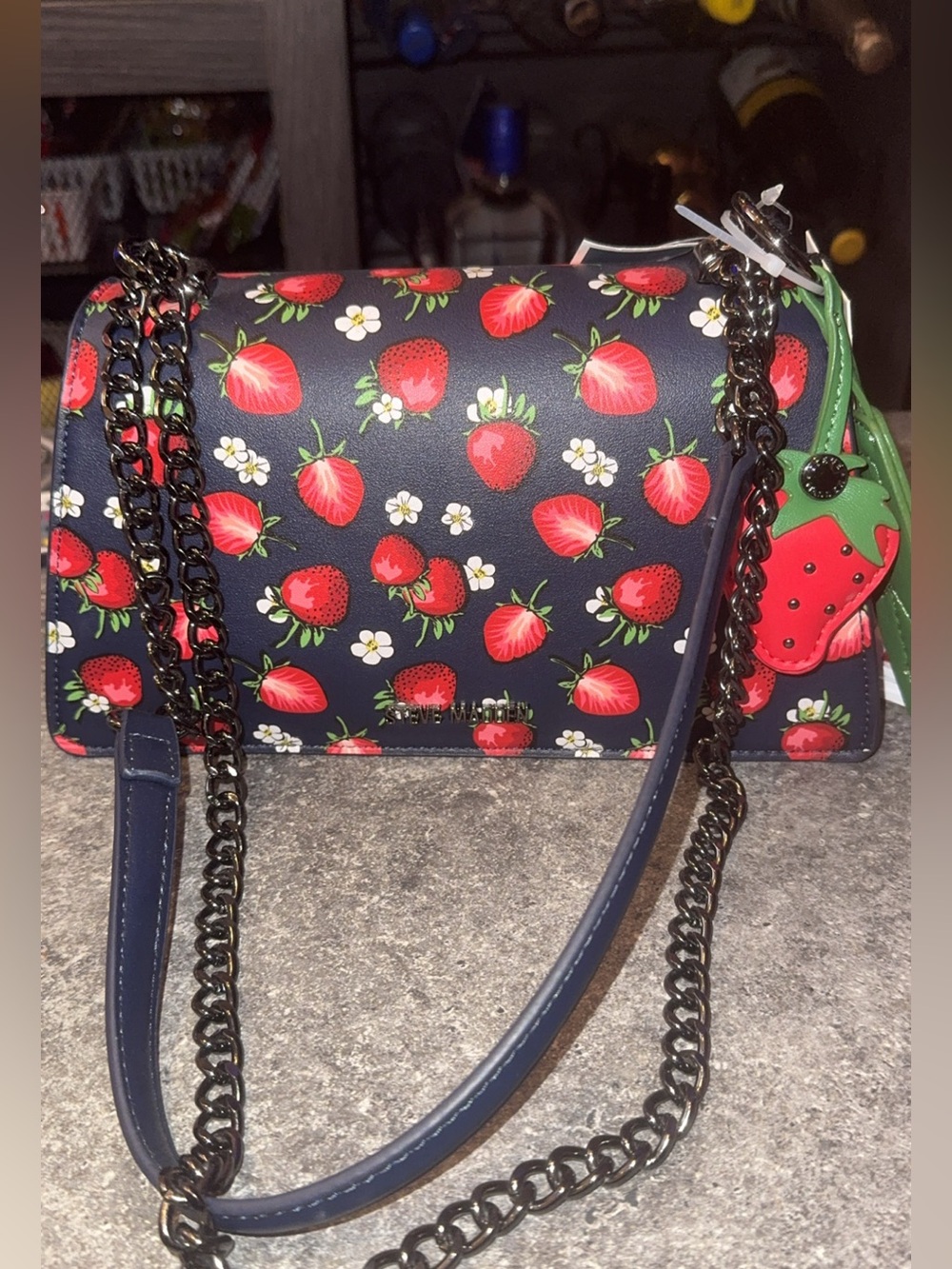 Steve Madden navy crossbody with red strawberry print